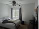 Bedroom featuring a window and a ceiling fan at 10524 Pine Gardens Ct # 203, Las Vegas, NV 89144