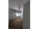 Bedroom with neutral carpet, ceiling fan, and a window with blinds at 10524 Pine Gardens Ct # 203, Las Vegas, NV 89144