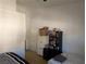 This bedroom features neutral walls, carpet flooring, and functional furniture at 10524 Pine Gardens Ct # 203, Las Vegas, NV 89144