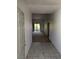 Condo entryway with tile floors leading to a spacious living area and balcony, providing a welcoming entrance at 10524 Pine Gardens Ct # 203, Las Vegas, NV 89144