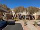 Exterior of a condo building showing the parking lot and open-air staircases at 10524 Pine Gardens Ct # 203, Las Vegas, NV 89144
