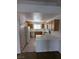 Functional kitchen featuring ample cabinetry, white appliances, and a breakfast bar for casual dining at 10524 Pine Gardens Ct # 203, Las Vegas, NV 89144