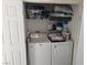 Compact laundry closet with a stacked washer and dryer for convenient washing at 10524 Pine Gardens Ct # 203, Las Vegas, NV 89144