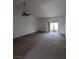 Spacious living room with large sliding doors to a balcony, offering natural light and a connection to the outdoors at 10524 Pine Gardens Ct # 203, Las Vegas, NV 89144
