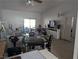 Spacious living room area with a sliding glass door to the balcony at 10524 Pine Gardens Ct # 203, Las Vegas, NV 89144