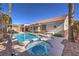 Backyard with pool, spa, and covered patio, perfect for outdoor entertaining and relaxation at 10649 Bella Ordaz Way, Las Vegas, NV 89141