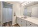 Bathroom with a white vanity, modern fixtures, and a shower/tub combo with a shower curtain at 10649 Bella Ordaz Way, Las Vegas, NV 89141