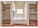 Bathroom featuring a soaking tub and access to two walk-in closets at 10649 Bella Ordaz Way, Las Vegas, NV 89141