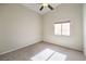 Bright bedroom featuring neutral carpet, a ceiling fan, and natural light from a window at 10649 Bella Ordaz Way, Las Vegas, NV 89141
