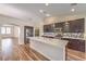 Well-lit kitchen with stainless steel appliances, large island, and ample cabinet space at 10649 Bella Ordaz Way, Las Vegas, NV 89141