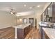 Modern kitchen with large island and stainless steel appliances, perfect for cooking and entertaining at 10649 Bella Ordaz Way, Las Vegas, NV 89141