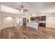 Modern kitchen with stainless appliances, pendant lighting and spacious breakfast bar at 10649 Bella Ordaz Way, Las Vegas, NV 89141