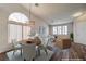 Bright living space with vaulted ceiling, modern chandelier, and stylish furniture at 10649 Bella Ordaz Way, Las Vegas, NV 89141