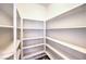 Walk-in pantry with multiple shelves for ample storage space at 10649 Bella Ordaz Way, Las Vegas, NV 89141