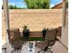 A private patio area featuring seating and lush greenery at 10649 Bella Ordaz Way, Las Vegas, NV 89141