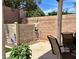 Cozy outdoor patio featuring stone accents, greenery, and comfortable seating at 10649 Bella Ordaz Way, Las Vegas, NV 89141