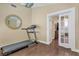 Bedroom features a doorway, neutral walls, and a treadmill at 144 Coventry Dr, Henderson, NV 89074