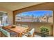 Inviting balcony with comfortable seating and scenic views of the community and clear blue sky at 1700 Hills Of Red Dr # 202, Las Vegas, NV 89128