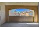 Picturesque balcony view of well-maintained community buildings under a bright blue sky at 1700 Hills Of Red Dr # 202, Las Vegas, NV 89128
