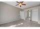 Spacious bedroom with carpet, mirrored closet, and ample natural light at 1700 Hills Of Red Dr # 202, Las Vegas, NV 89128