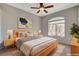 Cozy bedroom featuring a comfortable bed, soft lighting, and a relaxing atmosphere with window at 1700 Hills Of Red Dr # 202, Las Vegas, NV 89128