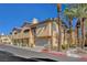 Tan two-story building with attached garages at 1700 Hills Of Red Dr # 202, Las Vegas, NV 89128