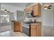 Modern kitchen with stainless steel appliances, granite countertops, and bright and airy space at 1700 Hills Of Red Dr # 202, Las Vegas, NV 89128