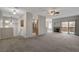 The large living area features an open floor plan, seamlessly connecting to the kitchen and fireplace at 1700 Hills Of Red Dr # 202, Las Vegas, NV 89128