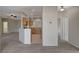 Spacious living room features neutral paint, carpet, ceiling fan, and seamless access to an open kitchen at 1700 Hills Of Red Dr # 202, Las Vegas, NV 89128
