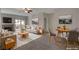 Bright living room with fireplace and dining area at 1700 Hills Of Red Dr # 202, Las Vegas, NV 89128
