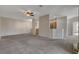 The expansive living area includes seamless access to the kitchen and a cozy fireplace at 1700 Hills Of Red Dr # 202, Las Vegas, NV 89128
