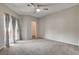 The main bedroom boasts a large closet and backyard access through sliding glass doors at 1700 Hills Of Red Dr # 202, Las Vegas, NV 89128