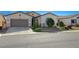 One-story house with a two-car garage and landscaped front yard at 1713 Sagebrush Ranch Way, North Las Vegas, NV 89081