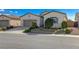 One-story house with a two-car garage and landscaped front yard at 1713 Sagebrush Ranch Way, North Las Vegas, NV 89081