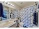 Clean bathroom with blue and white shower curtain at 2173 Aspen Mirror Way # 101, Laughlin, NV 89029