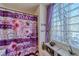 Bathroom with a glass block window and purple shower curtain at 2173 Aspen Mirror Way # 101, Laughlin, NV 89029