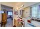 Bathroom with a double vanity and view into bedroom at 2173 Aspen Mirror Way # 101, Laughlin, NV 89029