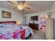 Spacious bedroom with floral bedding and ceiling fan at 2173 Aspen Mirror Way # 101, Laughlin, NV 89029