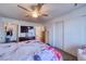 Main bedroom with TV, ceiling fan, and ample closet space at 2173 Aspen Mirror Way # 101, Laughlin, NV 89029