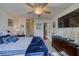 Relaxing bedroom with a large TV and dresser, plus a view of the bathroom at 2173 Aspen Mirror Way # 101, Laughlin, NV 89029