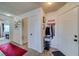 Bright entryway with red carpet, coat rack, and storage at 2173 Aspen Mirror Way # 101, Laughlin, NV 89029