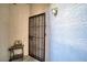 Front door entrance with security door and small table at 2173 Aspen Mirror Way # 101, Laughlin, NV 89029