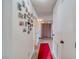 Hallway with red carpet runner and Gathering photos at 2173 Aspen Mirror Way # 101, Laughlin, NV 89029