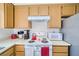 Kitchen features stove, microwave, and ample cabinetry at 2173 Aspen Mirror Way # 101, Laughlin, NV 89029