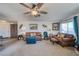 Living room with brown couches and a ceiling fan at 2173 Aspen Mirror Way # 101, Laughlin, NV 89029