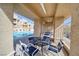 Relaxing poolside patio area with table and chairs at 2173 Aspen Mirror Way # 101, Laughlin, NV 89029