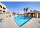 Community pool with surrounding lounge chairs and patio area at 2173 Aspen Mirror Way # 101, Laughlin, NV 89029