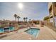 Community pool and spa with lounge chairs and covered seating at 2173 Aspen Mirror Way # 101, Laughlin, NV 89029