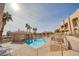 Community pool with plenty of lounge chairs for relaxation at 2173 Aspen Mirror Way # 101, Laughlin, NV 89029