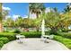 Outdoor patio space with modern patio furniture surrounded by lush landscaping and mature trees at 222 Karen Ave # 1005, Las Vegas, NV 89109